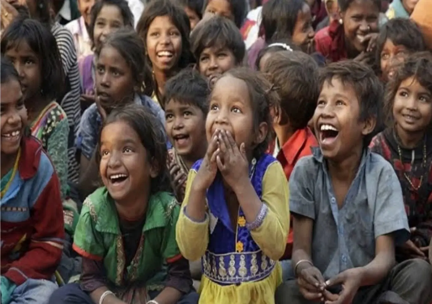 A group of children laughing together.